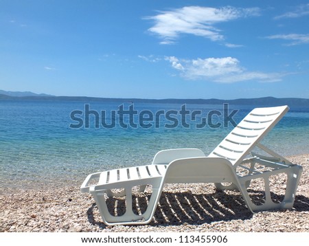 White deck-chairs on the shore of the Mediterranean Sea, Beach chairs,photography
