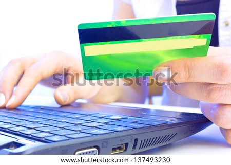 Young woman holding credit card on laptop for online shopping,Credit card, photography