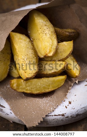 Baked potato slices in paper wrap