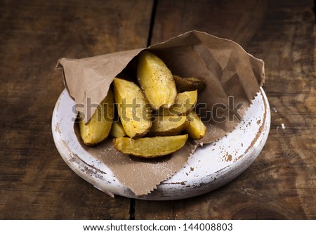 Baked potato slices in paper wrap