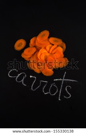 Sliced carrot vegetable isolated on black background