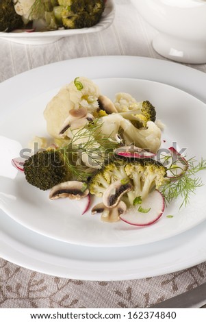 broccoli and cauliflower steamed with mushrooms. Vegan recipe