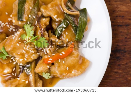 A delicious Chinese meal of Sweet and Sour Fish in sauce with vegetables