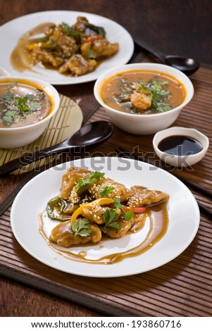 A delicious Chinese meal of Sweet and Sour Fish in sauce with vegetables