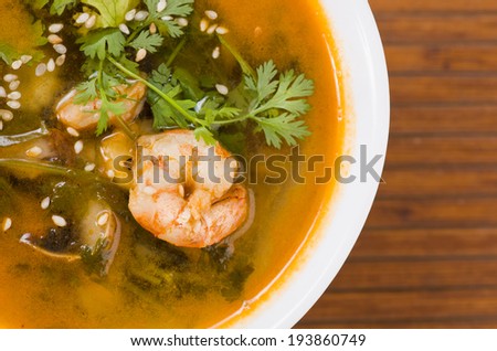 A delicious Chinese meal of Sweet and Sour Fish in sauce with vegetables. Mandarin fish and prawn soup tom yam