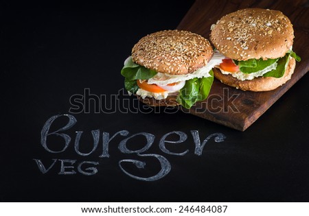 Burger on dark background with copy space