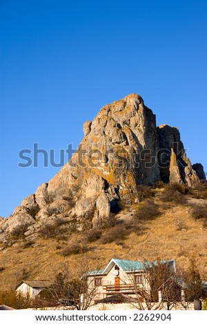Ranch house at the foot of the rock in Crimea