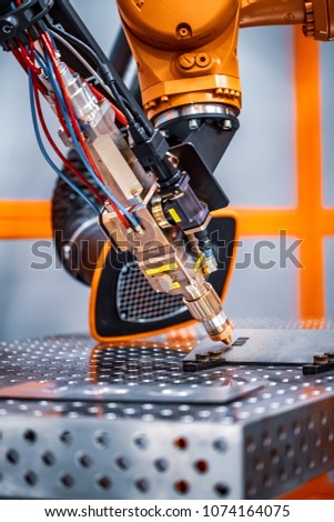 Fibre laser robotic remote cutting system. CNC Laser plasma cutting of metal, modern industrial technology.