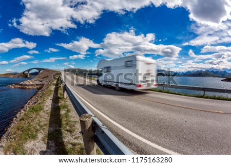 Caravan car RV travels on the highway. Caravan Car in motion blur. Norway. Atlantic Ocean Road or the Atlantic Road Atlanterhavsveien been awarded the title as \