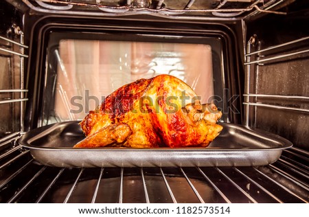 Roast chicken in the oven, view from the inside of the oven. Cooking in the oven. Thanksgiving Day.
