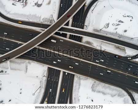 Aerial view of a freeway intersection Snow-covered in winter.