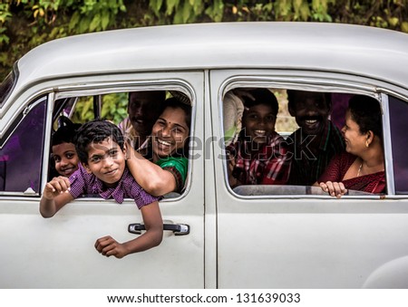 KERALA, INDIA - FEBRUARY 17: Happy unidentified family travels the country, Kerala February 17, 2013 in India. India is the world\'s second-most populous country. 1210193422 residents in the 2011 provisional census