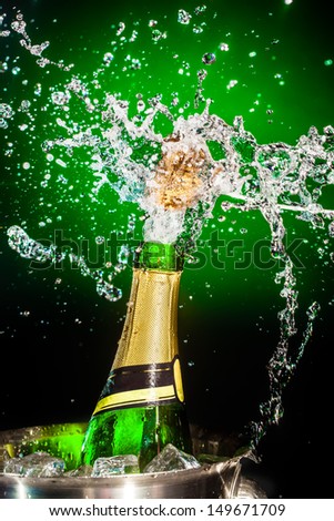 Splashing champagne on a green background