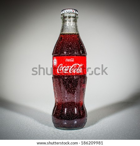 MOSCOW, RUSSIA-APRIL 4, 2014: Bottle of Coca-Cola. Coca-Cola is a carbonated soft drink sold in stores, restaurants, and vending machines throughout the world.