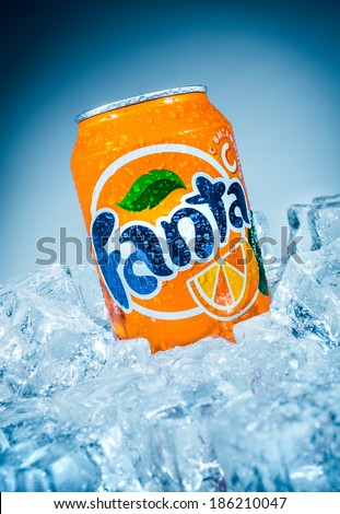 MOSCOW, RUSSIA-APRIL 4, 2014: Can of Coca Cola company soft drink Fanta Orange on ice. Fanta is a global brand of fruit-flavored carbonated soft drinks created by The Coca-Cola Company.