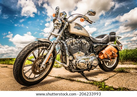 RUSSIA-JULY 7, 2013: Harley-Davidson Sportster 883 Low. Harley-Davidson sustains a large brand community which keeps active through clubs, events, and a museum. Filter applied in post-production.
