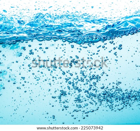 Many bubbles in water close up, abstract water wave with bubbles