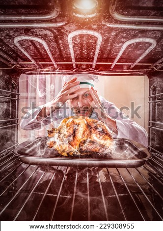 Funny chef overlooked roast chicken in the oven, so she had scorched, view from the inside of the oven. Cook perplexed and angry. Loser is destiny!