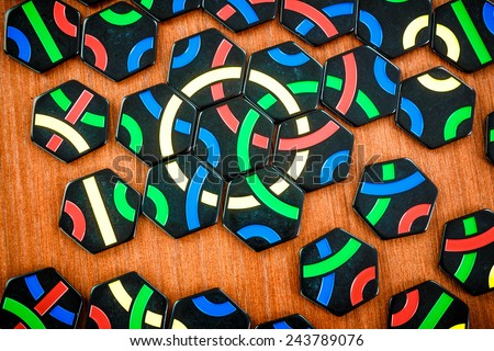 RUSSIA-JULY 7, 2013: Logic game Tantrix.Tantrix is a hexagonal tile-based abstract game invented by Mike McManaway from New Zealand. Each of the 56 different tiles in the set contains three lines.