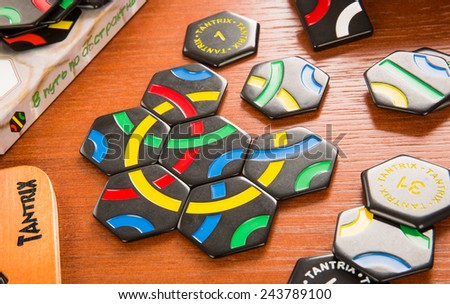 RUSSIA-JULY 7, 2013: Logic game Tantrix.Tantrix is a hexagonal tile-based abstract game invented by Mike McManaway from New Zealand. Each of the 56 different tiles in the set contains three lines.