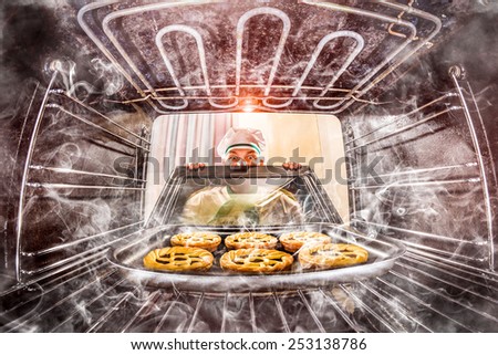 Funny chef overlooked pastries in the oven, so she had scorched, view from the inside of the oven. Cook perplexed and angry. Loser is destiny!