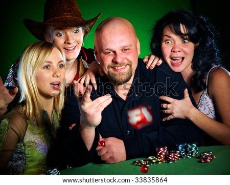company of friends plays dice...