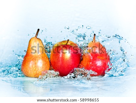 fresh water splash on red apple and pear