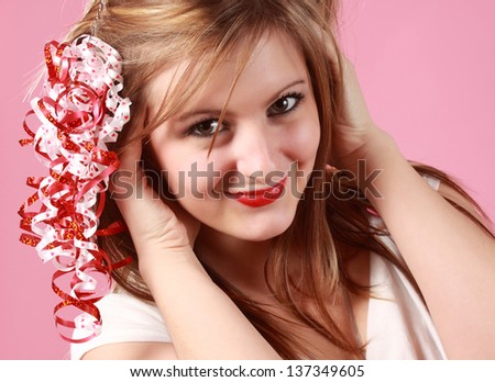 cute young caucasian woman with valentine\'s ribbon on her hair