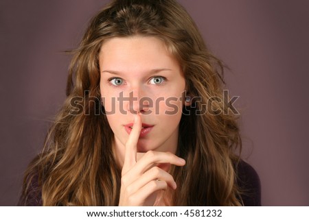 girl with finger on front of her mouth