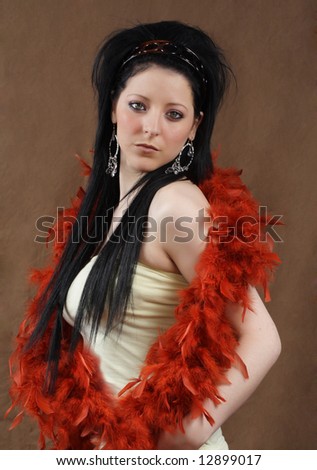 beautiful young woman with red feather boa