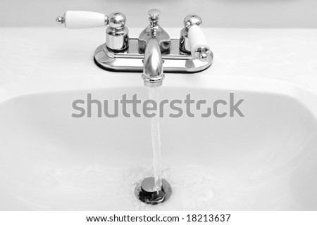potable sink running water, black and white