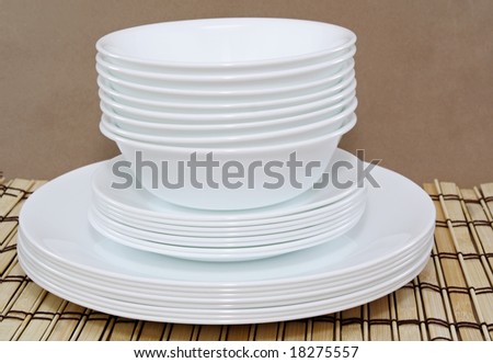 white bowls and plates stacked