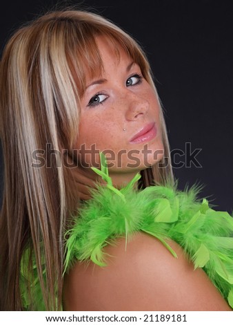 beautiful young woman with feather boa