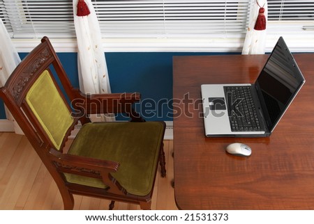 laptop on wood table in home interior,  near window