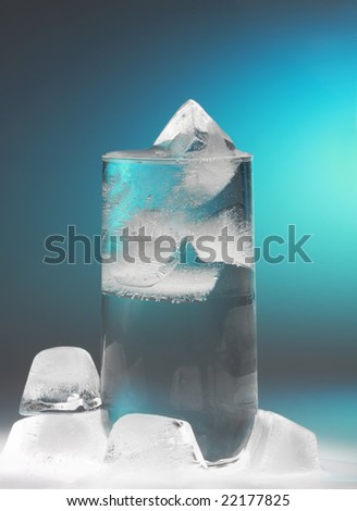 glass of water with ice cube, blue lighting