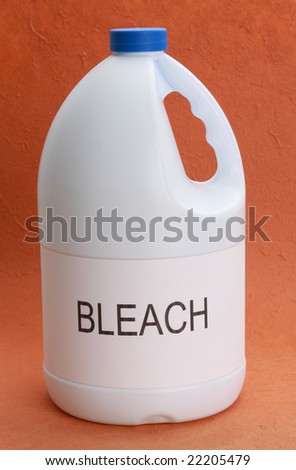 hite bottle of laundry bleach, blue cap, orange b