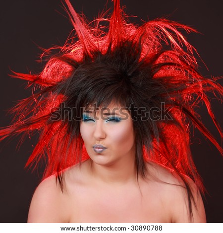 expressive girl with red light in her hair