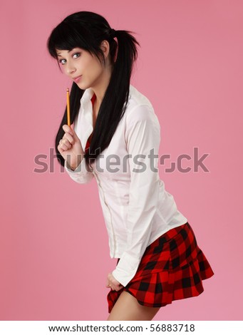 portrait of cute caucasian black haired woman, pink background