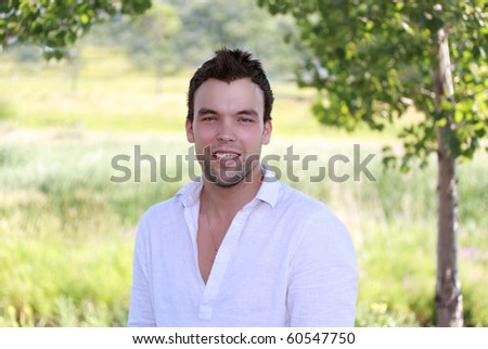 outdoor portrait of a cute young man