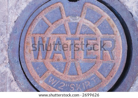 water sign that leads to underground infrastructure