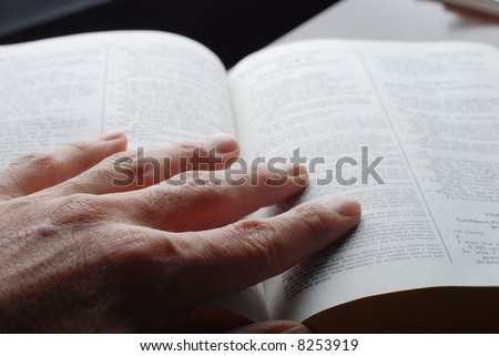 religious person is reading the holly bible