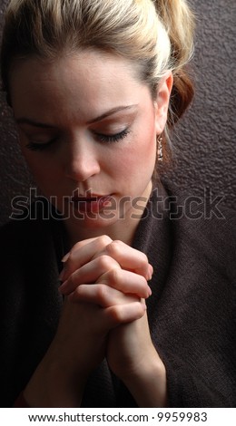 a woman is praying to god with hope