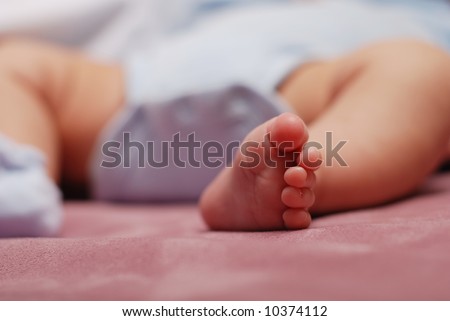 portrait of a cute new born baby\'s foot