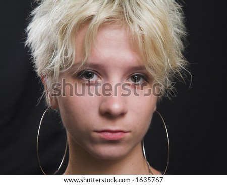 Portrait of beautiful young sexy woman on black background - head shot