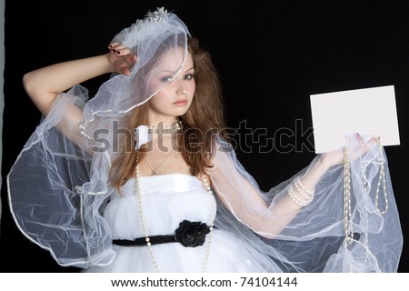 Business card or white sign - Portrait of a beautiful bride holding a blank note card.