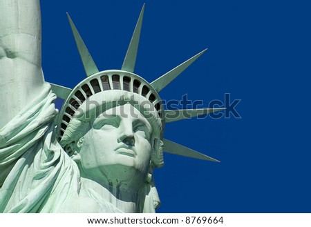 Close-Up of Statue of Liberty against a clear blue sky.