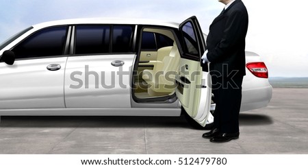 Driver waiting and standing next to the white limousine