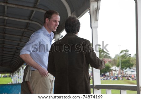 TOOWOOMBA, AUSTRALIA - MARCH 20: Prince William visits the \'Spirit of the Country\' flood relief country music concert on March 20, 2011 in Toowoomba, Australia. He stands with country music star Troy Cassar-Daley.