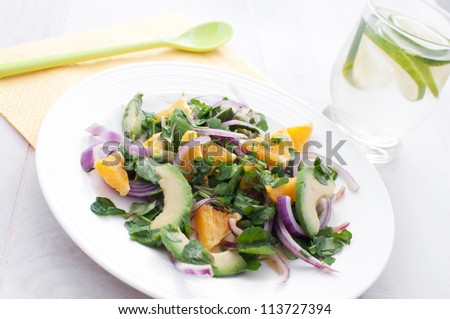 Watercress salad with onions, oranges and avocado