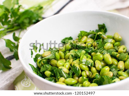Edamame soy beans salad with parsley closeup